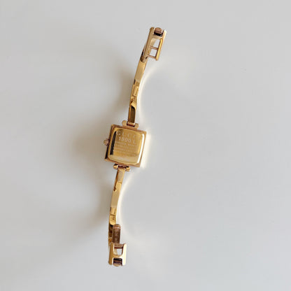 Gucci 1990s Seashell Square Dial Gold Plated Bangle Watch