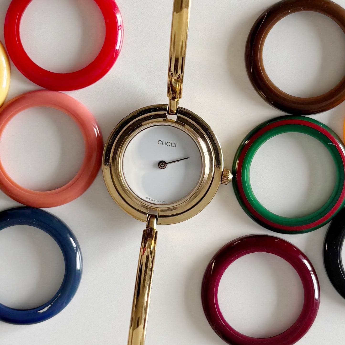 Gucci 1990s Interchangeable Bezel Gold Plated Bangle Watch with 12 bezels, case (Small)
