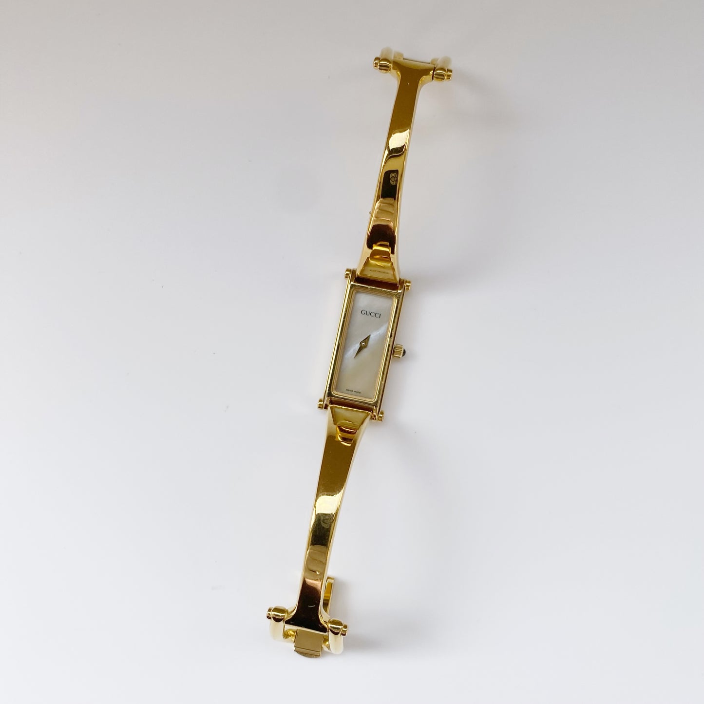 Gucci 1990s Rectangular Seashell Dial Gold Plated Bangle Watch