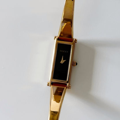 Gucci 1990s Rectangular Black Dial Gold Plated Bangle Watch