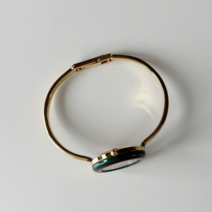 Gucci 1990s Interchangeable Bezel Gold Plated Bangle Watch with 12 bezels, case