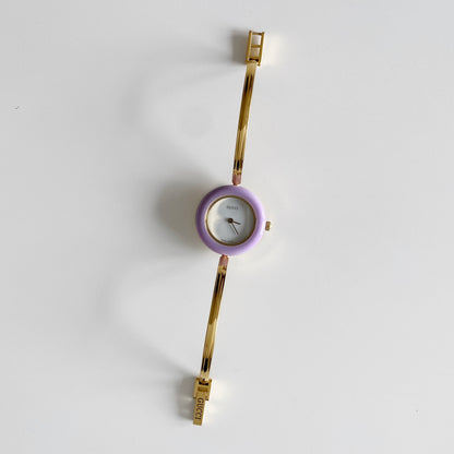 Gucci 1990s Interchangeable Bezel Gold Plated Bangle Watch with 12 bezels, case