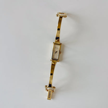 Gucci 1990s Seashell Rectangular Dial Gold Plated Bangle Watch