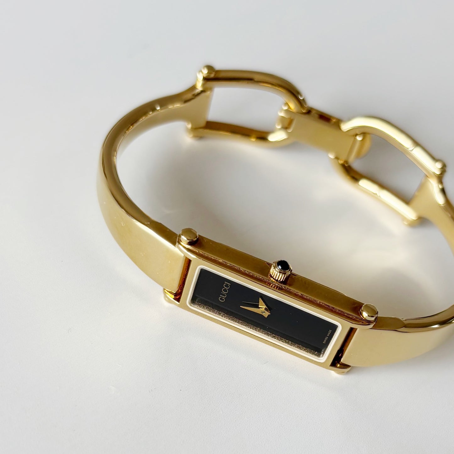Gucci 1990s Rectangular Black Dial Gold Plated Bangle Watch