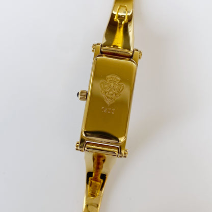 Gucci 1990s Rectangular Black Dial Gold Plated Bangle Watch