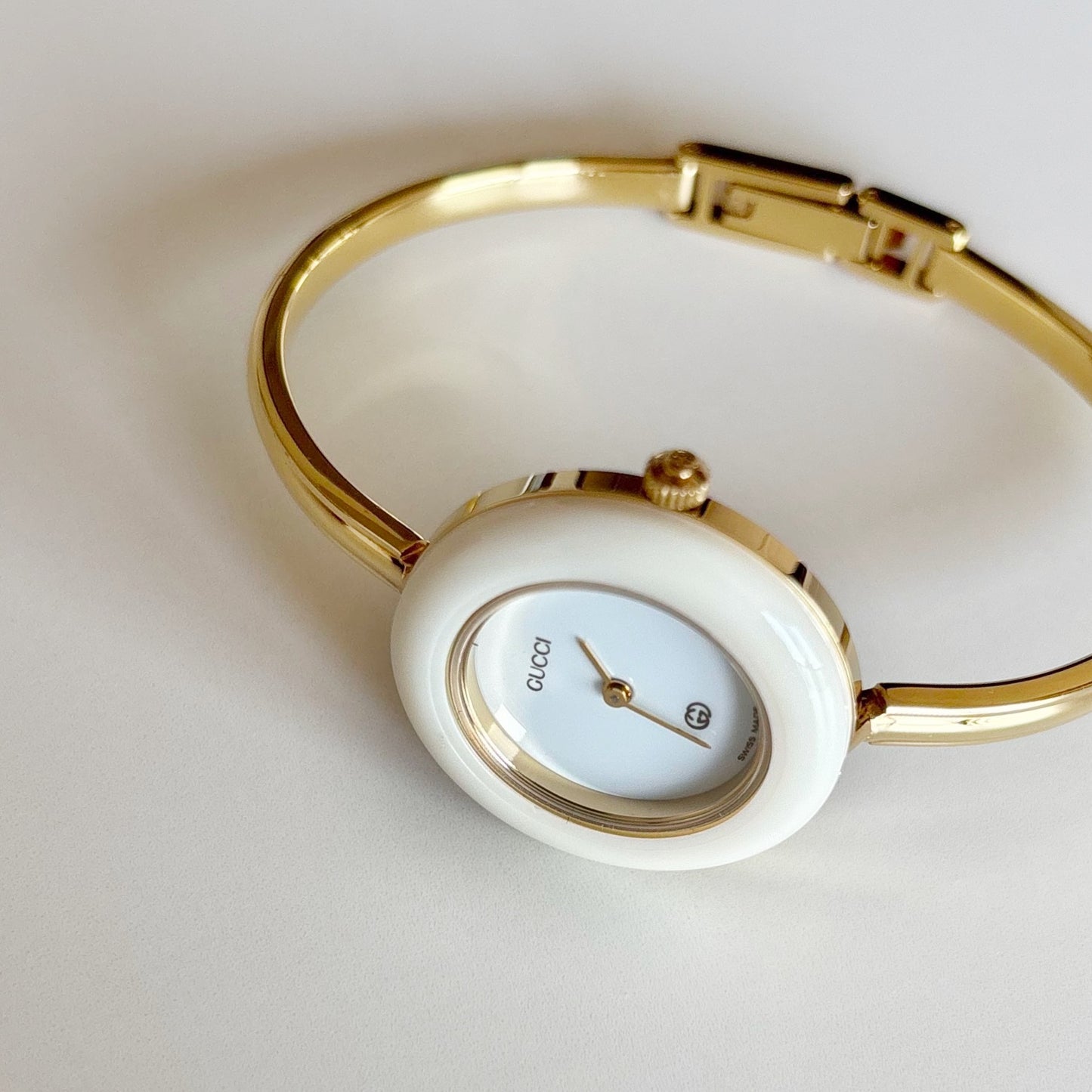 Gucci 1990s Interchangeable Bezel Gold Plated Bangle Watch with 12 bezels, case