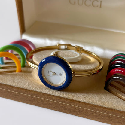 Gucci 1990s Interchangeable Bezel Gold Plated Bangle Watch with case, 12 bezels