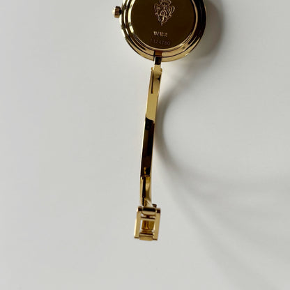 Gucci 1990s Interchangeable Bezel Gold Plated Bangle Watch with 12 bezels, case