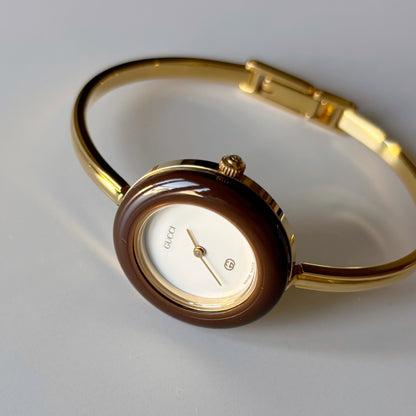 Gucci 1990s Interchangeable Bezel Gold Plated Bangle Watch with 12 bezels, case