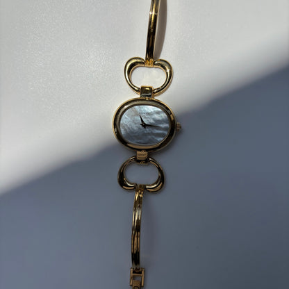 Gucci 1990s Seashell Oval Dial Gold Plated Bangle Watch (Small)