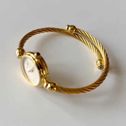 Gucci 1990s Seashell Round Dial Gold-Plated Cable Bangle Watch