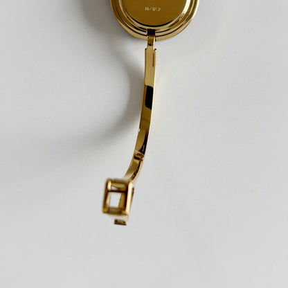 Gucci 1990s Interchangeable Bezel Gold Plated Bangle Watch with 12 bezels, case