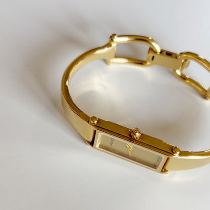 Gucci 1990s Gold Dial Rectangular Gold Plated Bangle Watch