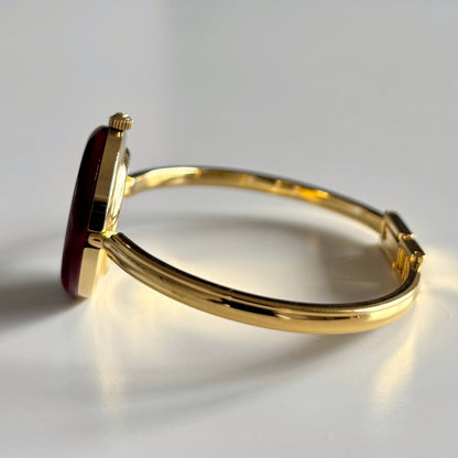 Gucci 1990s Interchangeable Bezel Gold Plated Bangle Watch with 12 bezels, case