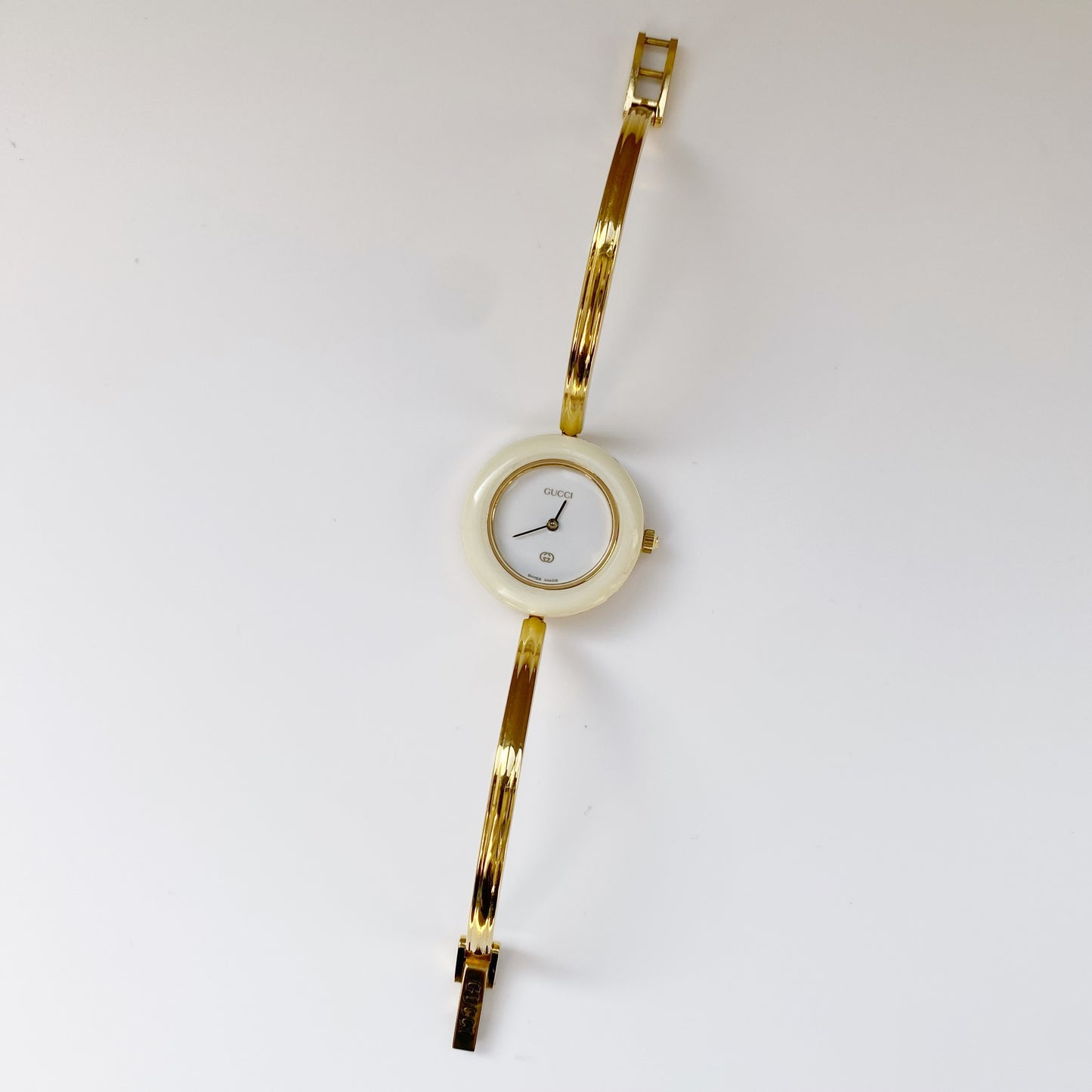 Gucci 1990s Interchangeable Bezel Gold Plated Bangle Watch with 12 bezels, case