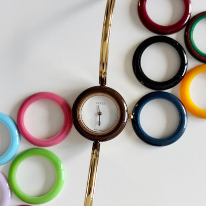 Gucci 1990s Interchangeable Bezel Gold Plated Bangle Watch with 12 bezels, case