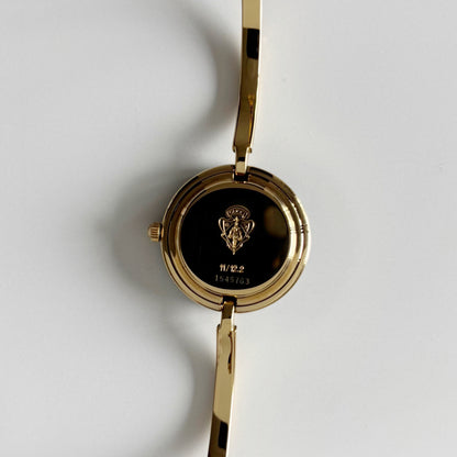 Gucci 1990s Interchangeable Bezel Gold Plated Bangle Watch with 12 bezels, case
