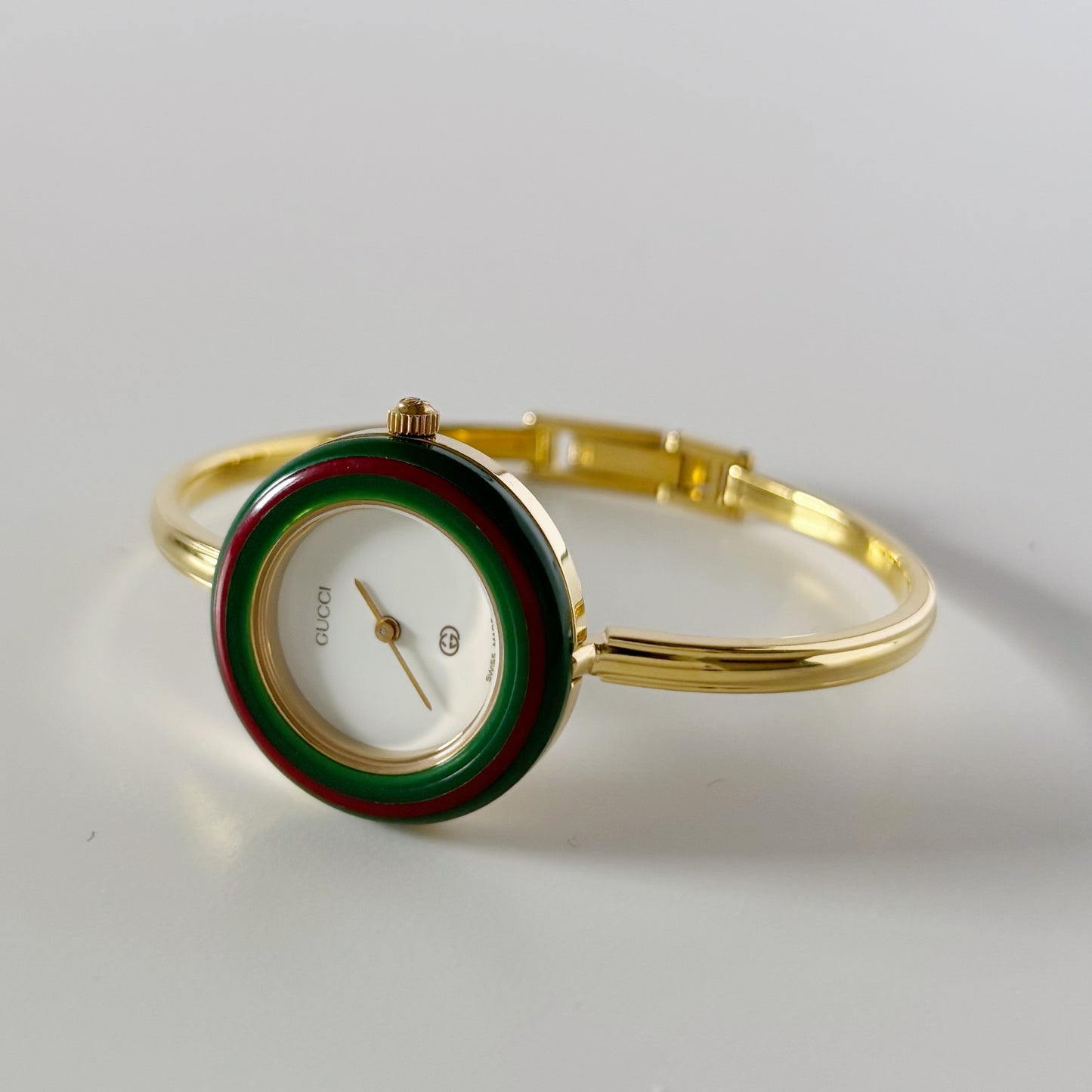 Gucci 1990s Interchangeable Bezel Gold Plated Bangle Watch with 12 bezels, case