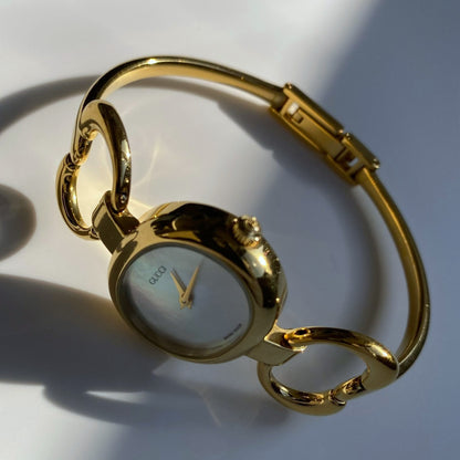 Gucci 1990s Seashell Dial Oval Gold Plated Bangle Watch