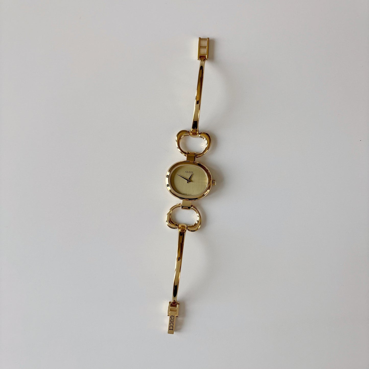 Gucci 1990s Oval Dial Gold Plated Bangle Watch