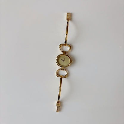 Gucci 1990s Oval Dial Gold Plated Bangle Watch