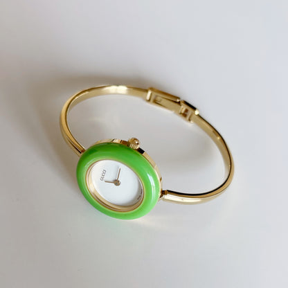 Gucci 1990s Interchangeable Bezel Gold Plated Bangle Watch with 12 bezels, case