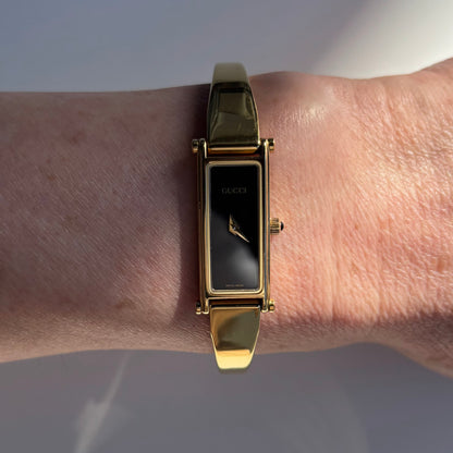 Gucci 1990s Black Dial Rectangular Gold Plated Bangle Watch