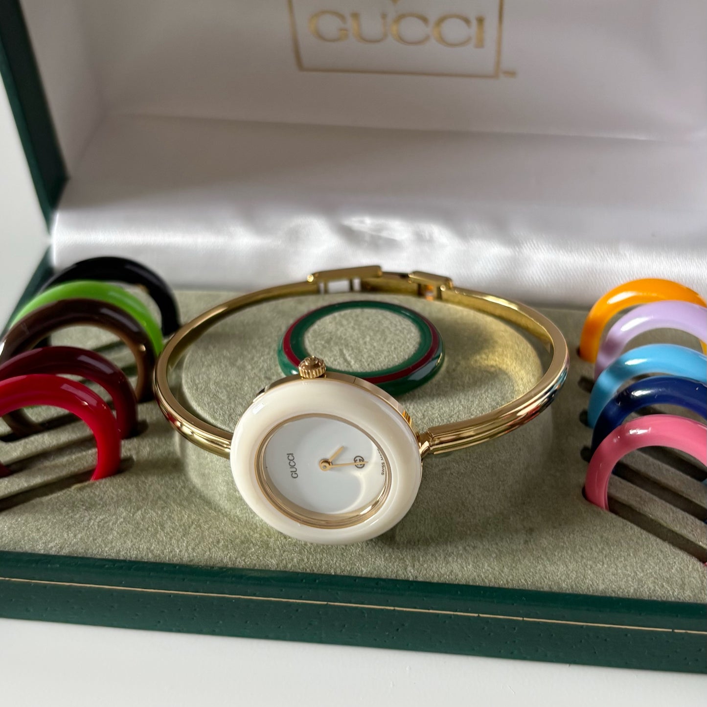Gucci 1990s Interchangeable Bezel Gold Plated Bangle Watch with 12 bezels, case