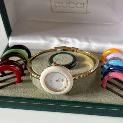 Gucci 1990s Interchangeable Bezel Gold Plated Bangle Watch with 12 bezels, case