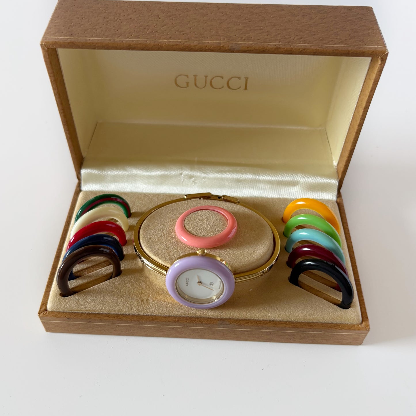 Gucci 1990s Interchangeable Bezel Gold Plated Bangle Watch with 12 bezels, case