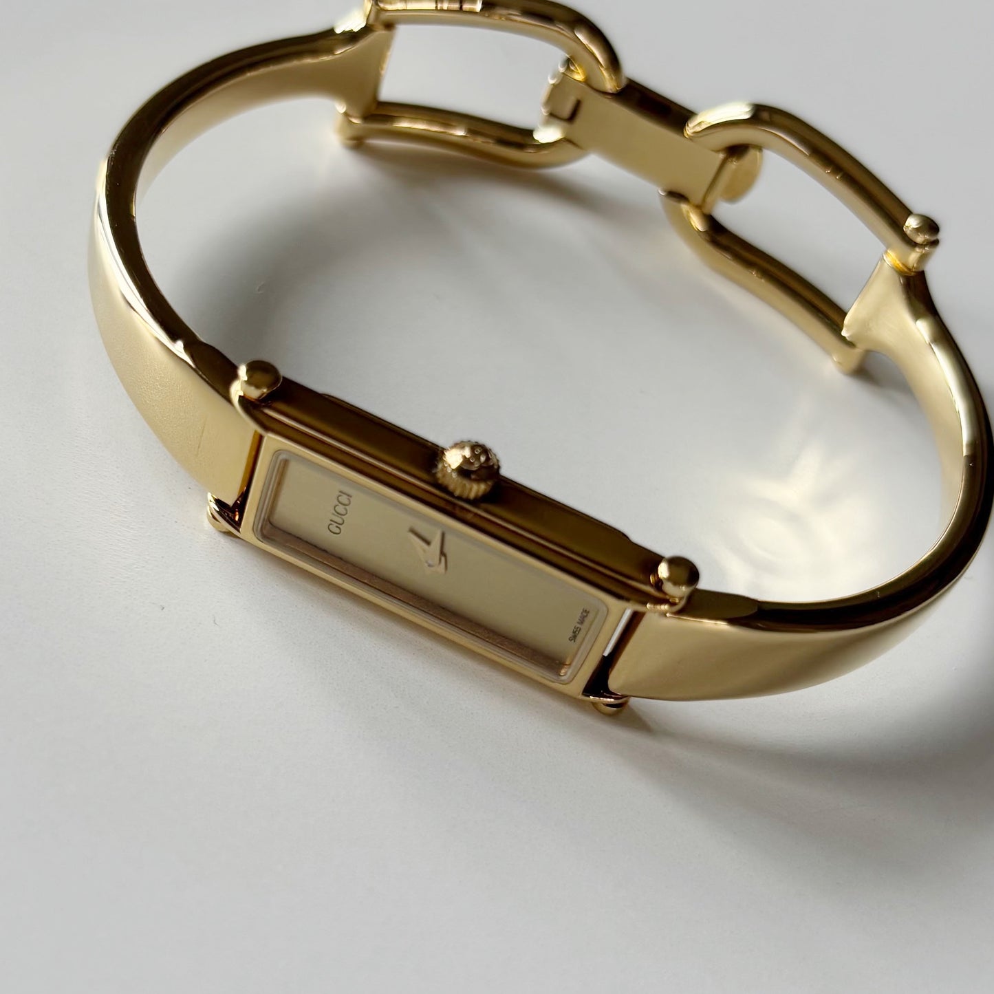 Gucci 1990s Gold Rectangular Dial Gold Plated Bangle Watch