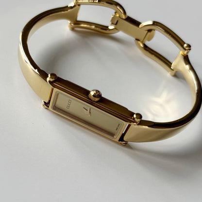 Gucci 1990s Gold Rectangular Dial Gold Plated Bangle Watch