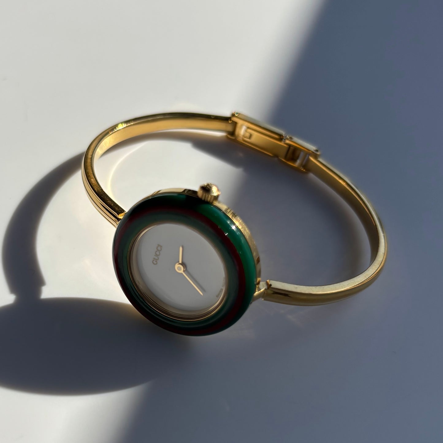 Gucci 1990s Interchangeable Bezel Gold Plated Bangle Watch with 12 bezels, case