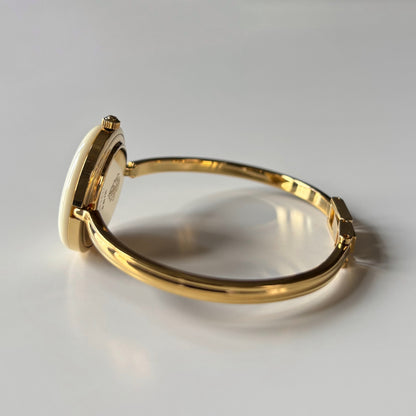 Gucci 1990s Interchangeable Bezel Gold Plated Bangle Watch with 12 bezels, case