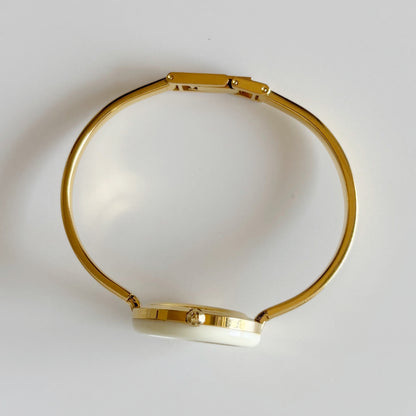Gucci 1990s Interchangeable Bezel Gold Plated Bangle Watch with 12 bezels, case