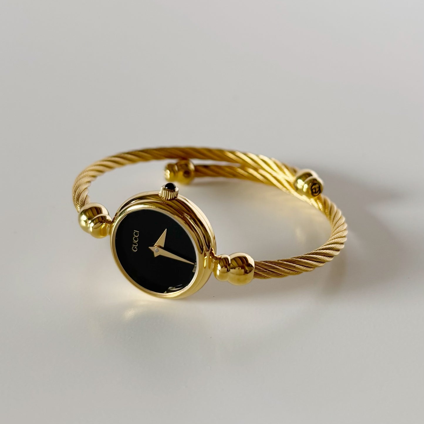 Gucci 1990s Black Dial Gold Plated Cable Bangle Watch