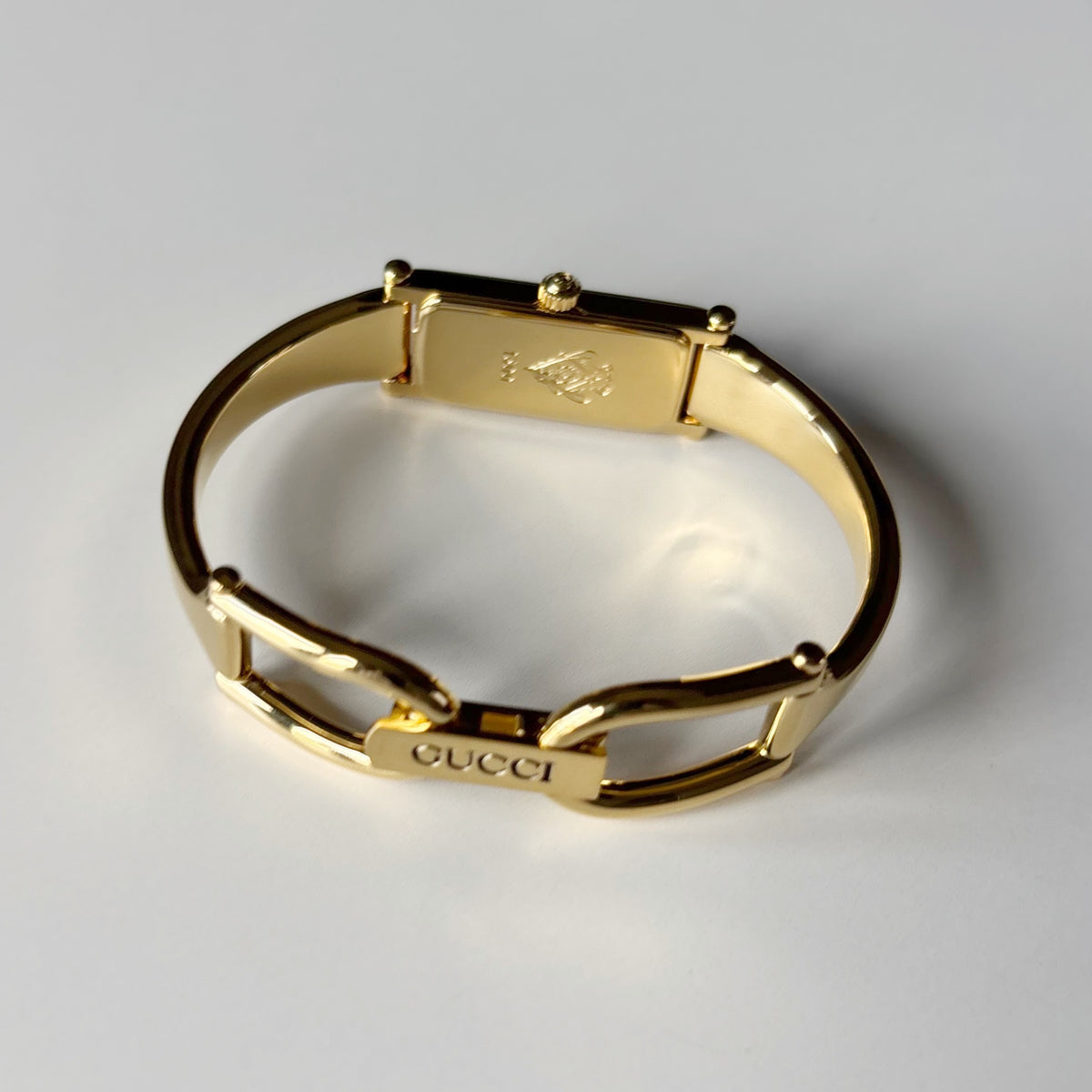Gucci 1990s Rectangular Gold Dial Gold Plated Bangle Watch (Small)