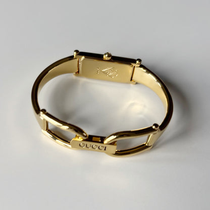 Gucci 1990s Rectangular Gold Dial Gold Plated Bangle Watch (Small)