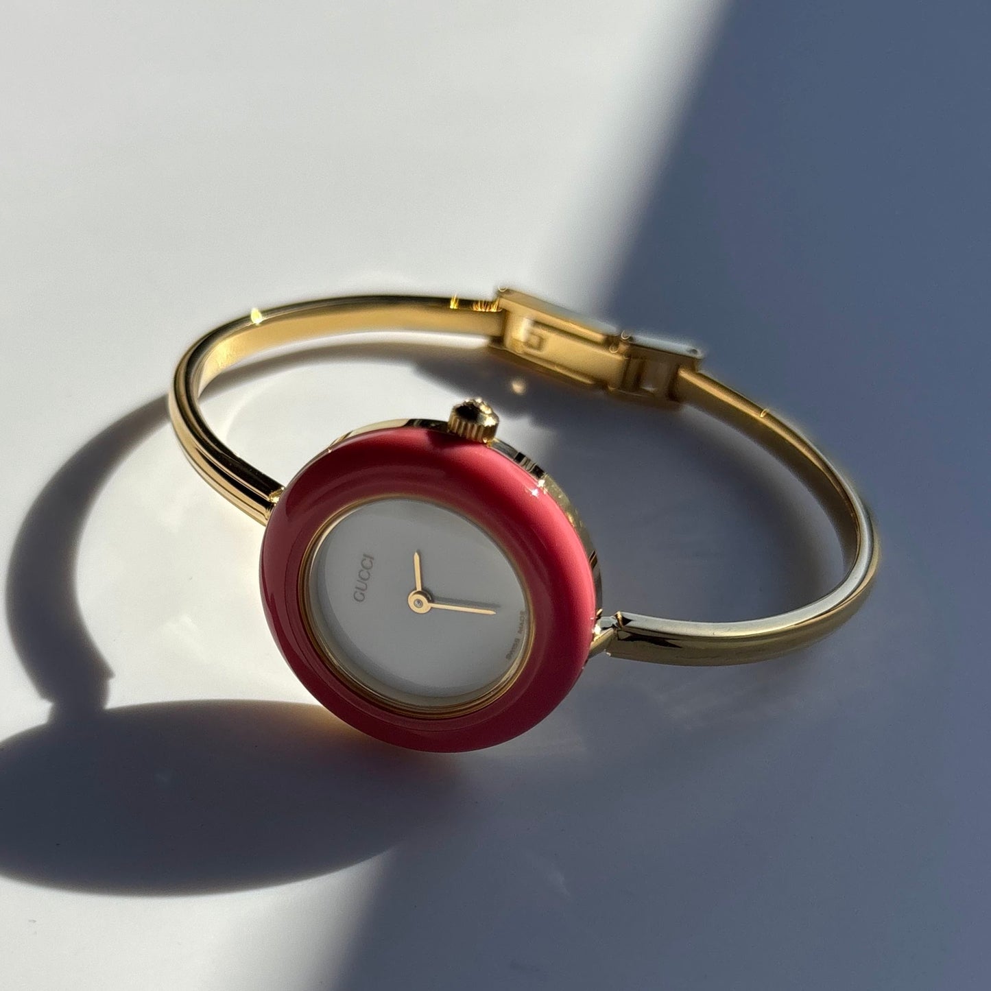 Gucci 1990s Interchangeable Bezel Gold Plated Bangle Watch with 12 bezels, case
