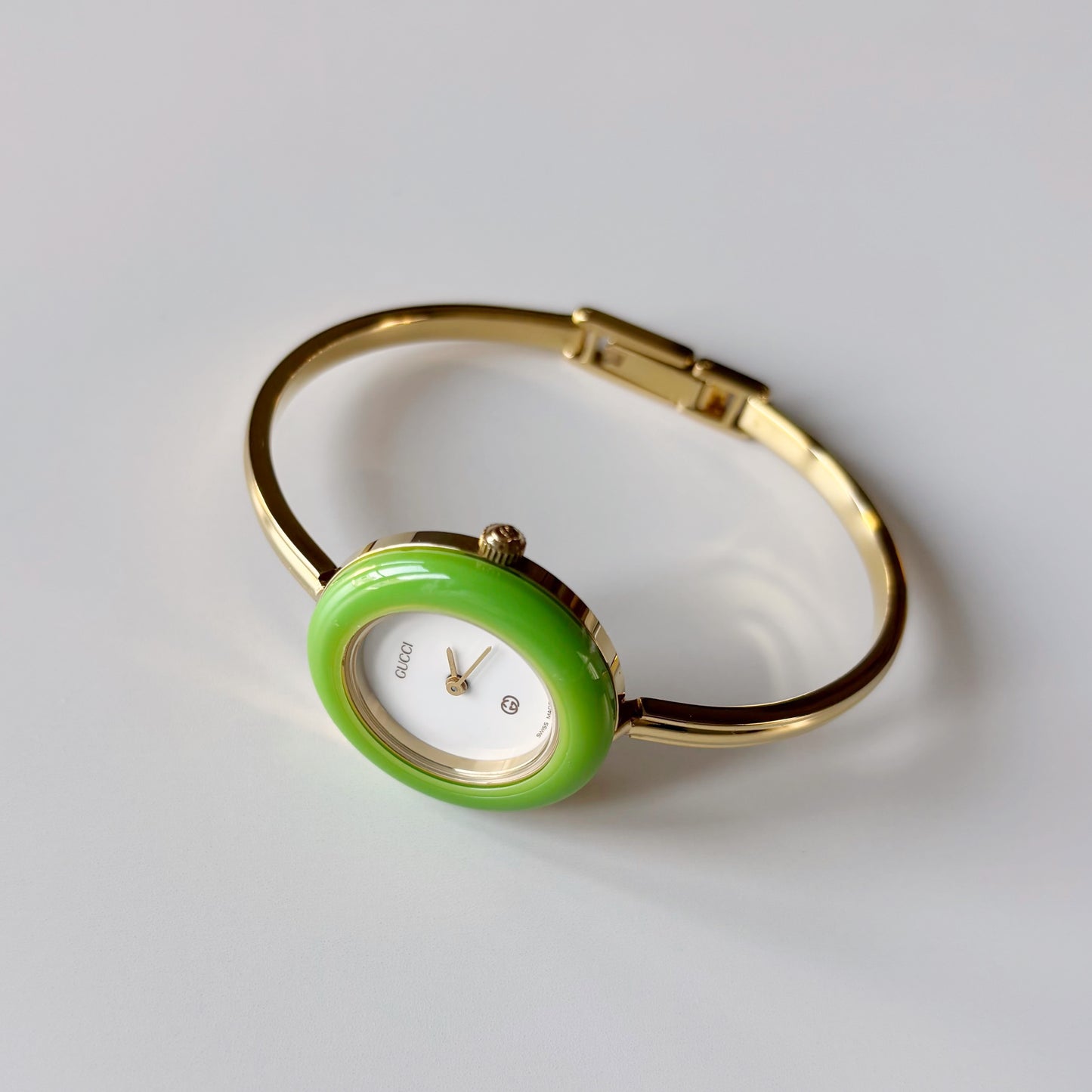 Gucci 1990s Interchangeable Bezel Gold Plated Bangle Watch with 12 bezels, case
