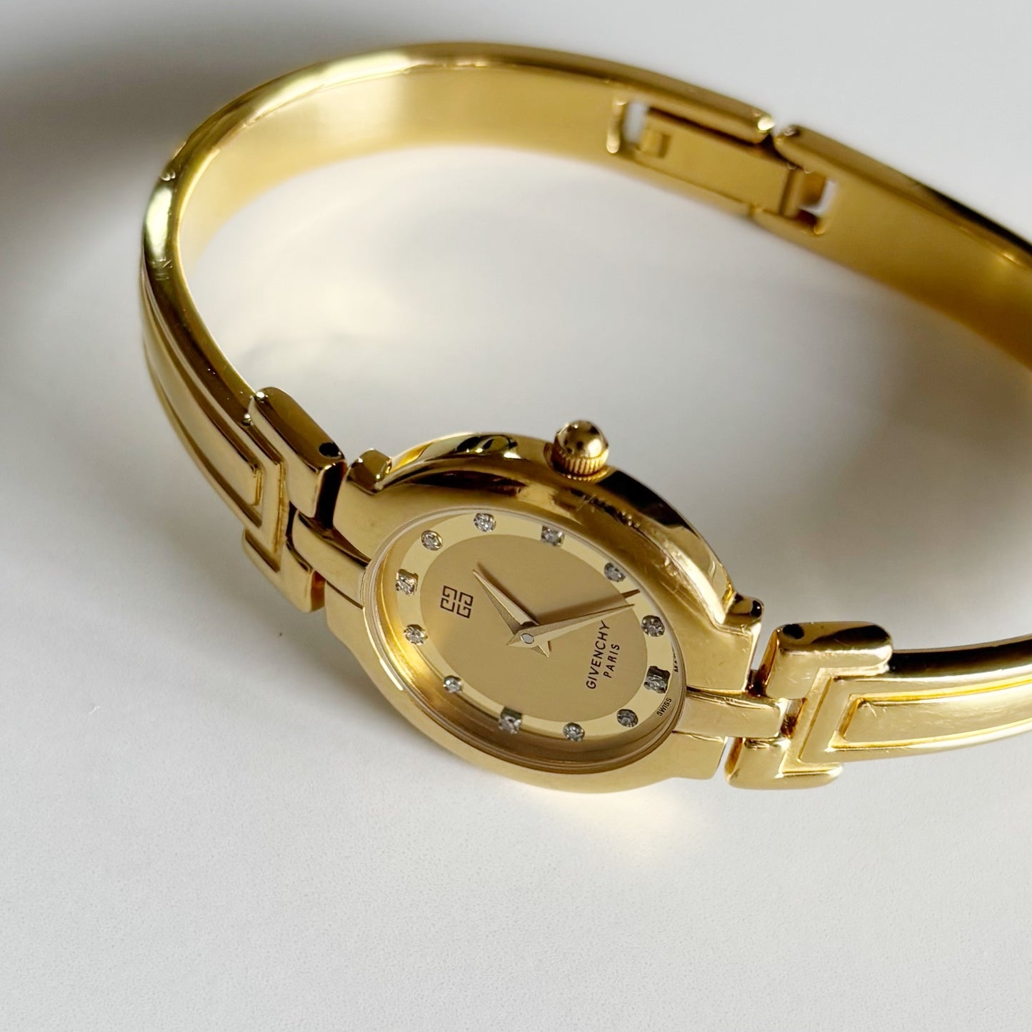 Givenchy 1990s Round Dial Gold Plated Bangle Watch