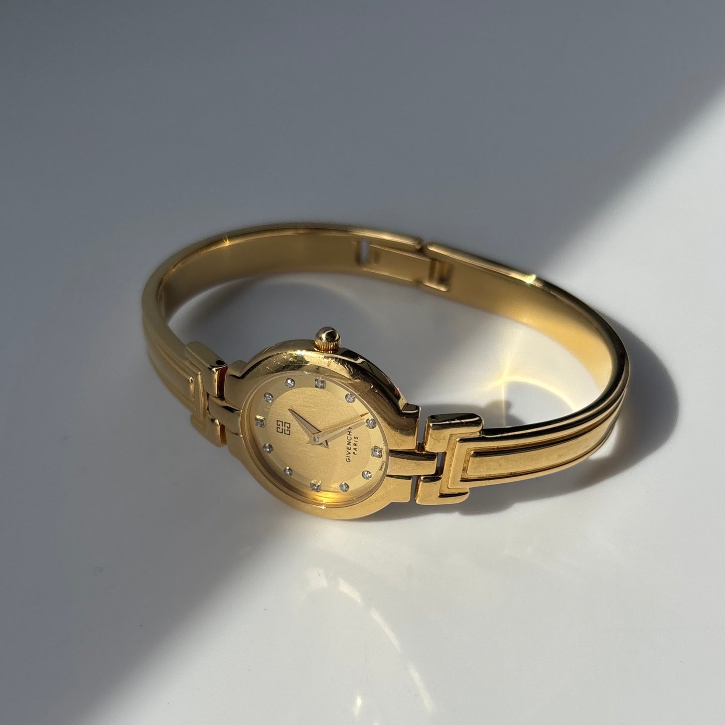Givenchy 1990s Round Dial Gold Plated Bangle Watch