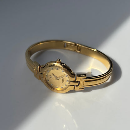 Givenchy 1990s Round Dial Gold Plated Bangle Watch