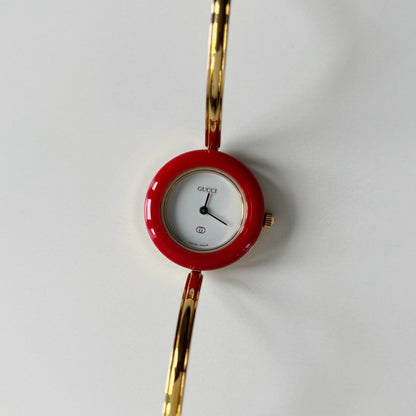 Gucci 1990s Interchangeable Bezel Gold Plated Bangle Watch with 12 bezels, case