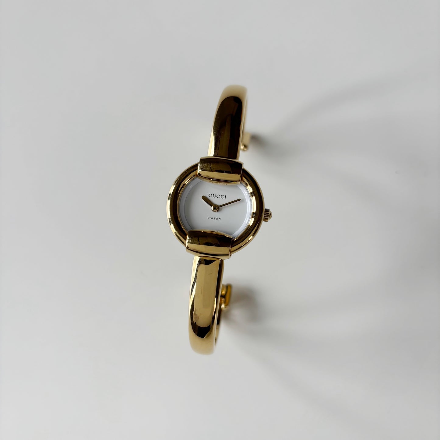 Gucci 1990s Round Dial Gold Plated Bangle Watch