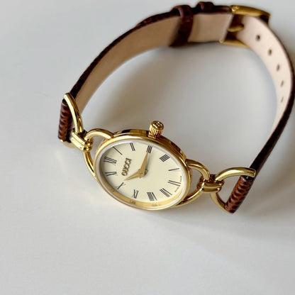 Gucci 1990s Round Cream Dial Horsebit Gold Plated Watch