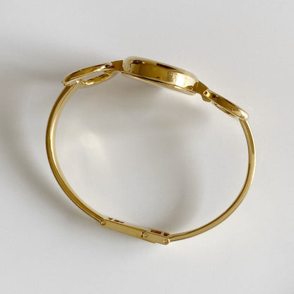 Gucci 1990s Black Dial Gold Plated Bangle Watch