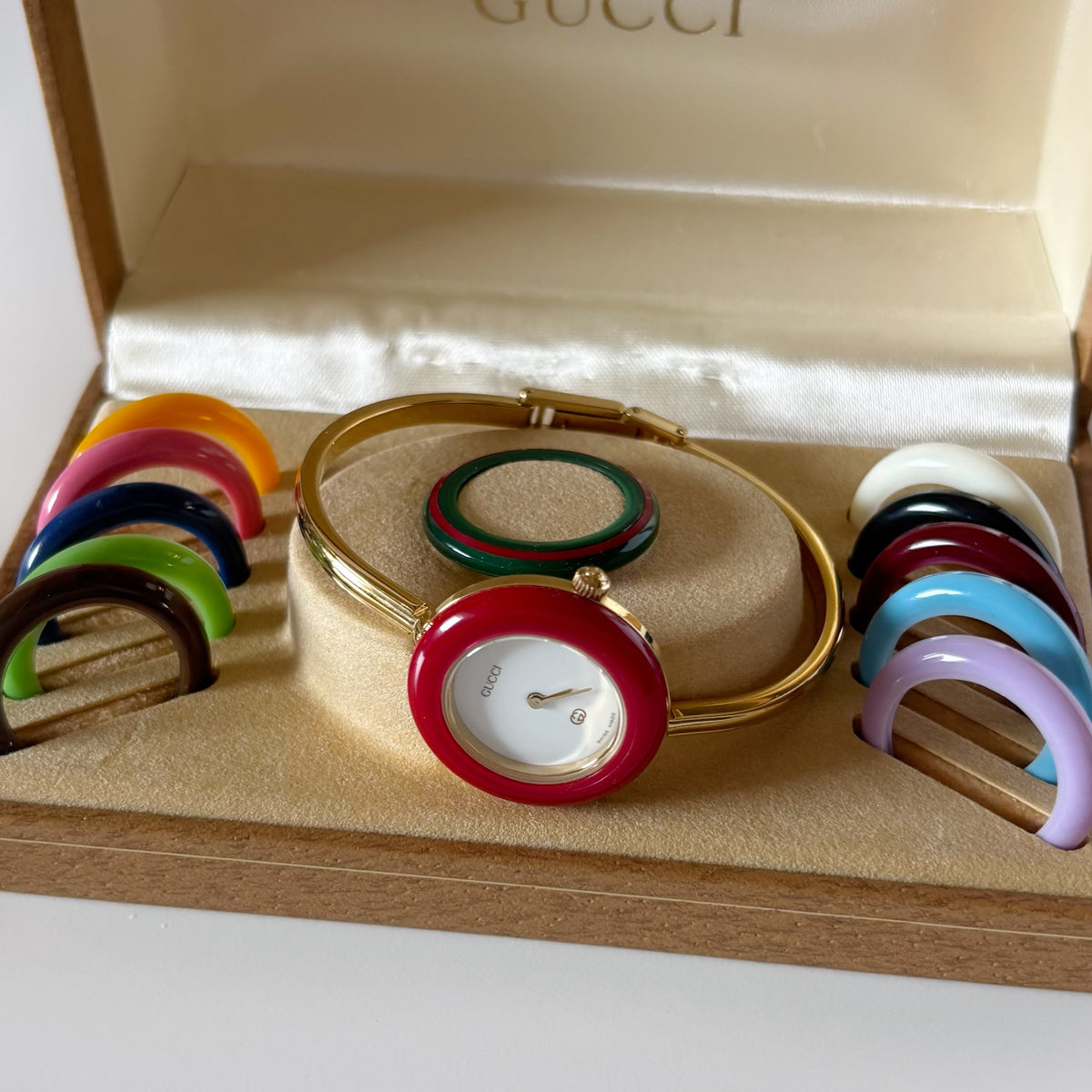 Gucci 1990s Interchangeable Bezel Gold Plated Bangle Watch with 12 bezels, case