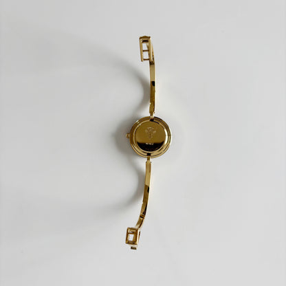 Gucci 1990s Interchangeable Bezel Gold Plated Bangle Watch with 12 bezels, case