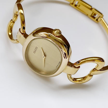 Gucci 1990s Oval Gold Plated Bangle Watch